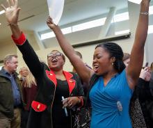 Lydia Michael (left) and her daughter, Ann Oluloro, celebrate Oluroro's residency match at OHSU's Match Day, March 17, 2017 in Portland.