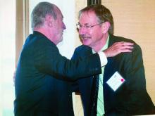 Dr. John A. Parrish, left, congratulates Dr. R. Rox Anderson on being recognized for his contributions to dermatology during a meeting of the American Society for Laser Medicine and Surgery.