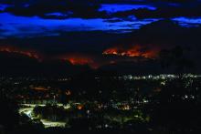 Canberra, Australia, 06 February 2020. Fires in the Brindabella National park, South of Canberra, threaten suburbs. The smoke from the fires increases the air pollution and creates a dark cloud over the city.