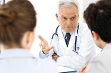 A doctor talks to patients