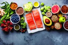 Healthy food selection: fish, fruit, vegetable, seeds, superfood, cereals, leaf vegetable