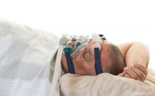 A patient wears a CPAP device
