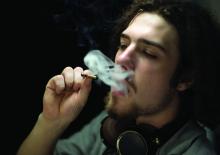Teen smoking joint