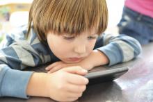 A young boy with cell phone