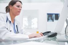 Female doctor using a computer