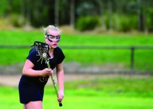 Girl playing lacrosse