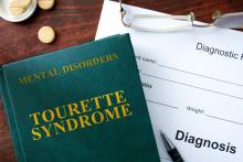 A book on Tourette Syndrome and diagnosis paper.