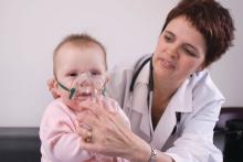 Doctor with baby and nebulizer