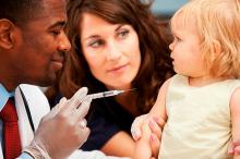 Small child receiving a vaccine