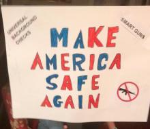 A poster that reads, &quot;Make America Safe Again&quot;