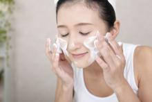 Woman washing her face