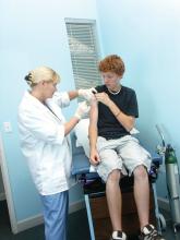 Teen male receiving vaccination