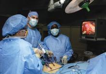 Dr. Ronald Post (left) and Dr. John Smear (center) and physician assistant Debra Blackshire perform laparoscopic stomach surgery.
