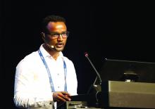 Digsu Koye, PhD, a postdoctoral research fellow at the also of the Melbourne EpiCentre at the University of Melbourne (Australia) at a lectern