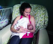 A woman breastfeeds her child