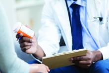 doctor gives patient prescription medication