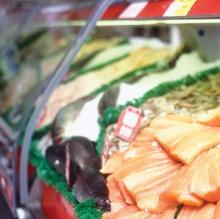 Photo of seafood in a deli case.