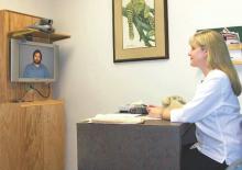 Dr. Karen Edison of the University of Missouri Health, Columbia, uses teledermatology to speak with a patient.