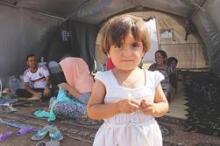 Some of the 12,000 Iraqi Yazidi refugees that have arrived at Newroz camp in Al-Hassakah province, Northeastern Syria, after fleeing Islamic State militants.