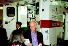 Dr. James C. Grotta, a neurologist and director of the Mobile Stroke Unit for the University of Texas at Houston discusses the stroke ambulance with visitors at the International Stroke Conference in Nashville.