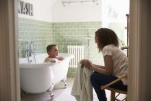 Mother And son having fun at bath time together.