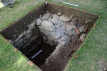 The excavated stone lined privy once attached to the Ripley/Choate House on Dartmouth's campus in Hanover, N.H
