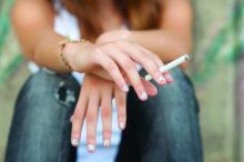 A smoking teenage girl is shown.