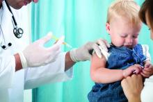 A doctor vaccinates a toddler